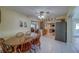 Open-concept dining area flowing into the kitchen and living spaces at 13057 89Th Ave, Seminole, FL 33776