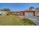 Charming single-story home with a well-maintained lawn, neutral exterior, and attached two-car garage at 13057 89Th Ave, Seminole, FL 33776