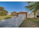 A well-maintained single-Gathering home with a spacious driveway and a two-car garage at 13057 89Th Ave, Seminole, FL 33776