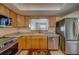 Bright kitchen boasts stainless steel appliances and convenient dishwasher at 13057 89Th Ave, Seminole, FL 33776