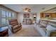 Spacious living room featuring neutral walls, a ceiling fan, and comfortable furnishings at 13057 89Th Ave, Seminole, FL 33776