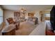 Comfortable living room with plush seating, ceiling fan, and an open layout flowing into the kitchen at 13057 89Th Ave, Seminole, FL 33776