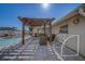 Sunny pool and brick patio area with a pergola, providing a great outdoor space for recreation and leisure at 13057 89Th Ave, Seminole, FL 33776
