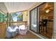 Balcony with chairs, showing access to the interior at 134 Sycamore Ln # H, Oldsmar, FL 34677