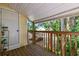 View of the balcony with open wooden railings at 134 Sycamore Ln # H, Oldsmar, FL 34677