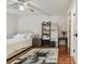 Cozy bedroom featuring hardwood floors, modern decor, and plenty of natural light at 134 Sycamore Ln # H, Oldsmar, FL 34677