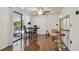 Dining area with a table, chairs, and a view of the outdoor patio at 134 Sycamore Ln # H, Oldsmar, FL 34677