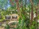 Exterior home view with green shutters and landscaping at 134 Sycamore Ln # H, Oldsmar, FL 34677