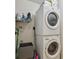 Efficient laundry area with stacked washer and dryer for space-saving convenience at 134 Sycamore Ln # H, Oldsmar, FL 34677