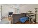 Cozy living room with hardwood floors, a blue storage ottoman, and a shoe rack at 134 Sycamore Ln # H, Oldsmar, FL 34677