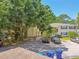 Exterior of home with parking lot and car at 134 Sycamore Ln # H, Oldsmar, FL 34677