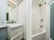 This well-lit bathroom offers both a shower and a bathtub for convenience at 135 92Nd Ave # 2, Treasure Island, FL 33706