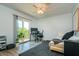 Bedroom setup as an office space with a desk, balcony access, and natural light for productivity at 135 92Nd Ave # 2, Treasure Island, FL 33706