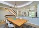 Open floor plan featuring dining area, kitchen, and stairs leading up to the bedrooms at 135 92Nd Ave # 2, Treasure Island, FL 33706