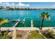 Beautiful waterfront property with a private dock with lift and a tropical palm tree at 135 92Nd Ave # 2, Treasure Island, FL 33706