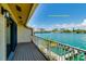 Balcony provides a relaxing outdoor space with views of the water, nearby boats, and city buildings at 135 92Nd Ave # 2, Treasure Island, FL 33706
