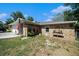 Single-story brick home with a two-car garage and well kept yard at 1399 Leeward Ave, Spring Hill, FL 34606