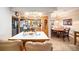 Open kitchen with island, traditional cabinetry, and view into the dining area at 1399 Leeward Ave, Spring Hill, FL 34606