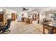 Open floor plan with tile flooring connecting the living, dining, and kitchen areas at 1399 Leeward Ave, Spring Hill, FL 34606