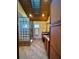 Bathroom with dual sinks, granite countertops, a walk-in shower, and decorative lighting at 14678 Village Glen Cir, Tampa, FL 33618