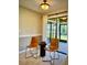 Bright dining area with contemporary chairs, stylish decor, and sliding glass doors leading to the outdoor patio at 14678 Village Glen Cir, Tampa, FL 33618