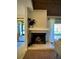 Cozy fireplace with decorative mantle, a great focal point for gatherings, seamlessly connects to outdoor spaces at 14678 Village Glen Cir, Tampa, FL 33618