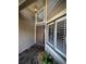 Inviting entrance with a decorative door, transom window and stone-accented walkway at 14678 Village Glen Cir, Tampa, FL 33618