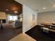 Open concept featuring the dining and living room with a fireplace, neutral walls, and tile floors at 14678 Village Glen Cir, Tampa, FL 33618
