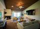 Open concept living room with wood ceiling, fireplace, and sliding glass doors to the backyard at 14678 Village Glen Cir, Tampa, FL 33618