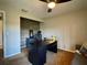 Home office featuring an accent wall, a modern desk, and an ergonomic chair at 14678 Village Glen Cir, Tampa, FL 33618