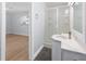 Bathroom with step-in shower and vanity; the bedroom is through the doorway at 1711 S Patlin Cir, Largo, FL 33770