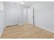 Bedroom with hardwood floors, closet and large windows at 1711 S Patlin Cir, Largo, FL 33770