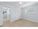 Bright bedroom featuring hardwood floors, a ceiling fan and large closet at 1711 S Patlin Cir, Largo, FL 33770