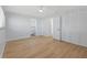 Bedroom with light walls, wood-look flooring, ceiling fan and large closet for ample storage at 1711 S Patlin Cir, Largo, FL 33770