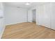 Bedroom with hardwood floors, closet and large windows at 1711 S Patlin Cir, Largo, FL 33770