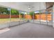 Screened porch overlooking the backyard and surrounding trees; ceiling fan included at 1711 S Patlin Cir, Largo, FL 33770