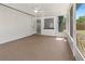 Screened porch with access to both the home's interior and the backyard at 1711 S Patlin Cir, Largo, FL 33770