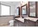 Bathroom with a sink, and marble counter vanity offering a luxurious and functional design at 18714 Chemille Dr, Lutz, FL 33558