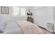 Comfortable bedroom with bright natural light from shuttered window and closet for ample storage at 18714 Chemille Dr, Lutz, FL 33558