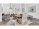 Elegant dining room showcases natural light, a chess table and a cozy seating area at 18714 Chemille Dr, Lutz, FL 33558