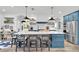 Elegant kitchen boasts a large island, pendant lighting, and stainless steel appliances at 18714 Chemille Dr, Lutz, FL 33558