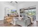 Bright living room with comfortable seating, a sliding glass door, and a view of the outdoor space at 18714 Chemille Dr, Lutz, FL 33558