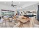 Spacious living area features an open floor plan, stylish furniture and easy access to the kitchen and outdoor pool at 18714 Chemille Dr, Lutz, FL 33558