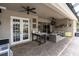 Covered patio with furniture, creating an inviting outdoor living space for relaxation and entertainment at 18714 Chemille Dr, Lutz, FL 33558