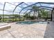 Enclosed pool with brick pavers and lounge seating for relaxing in the sun at 18714 Chemille Dr, Lutz, FL 33558