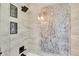 Modern shower with a rain shower head and stylish tile work, creating a luxurious bathing experience at 18714 Chemille Dr, Lutz, FL 33558