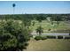 Scenic aerial view of a golf course with lush green fairways, trees, and landscaping at 200 N Betty Ln # 5F, Clearwater, FL 33755