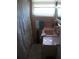 Vintage bathroom featuring pink tile, white ruffled shower curtain, and a window at 200 N Betty Ln # 5F, Clearwater, FL 33755