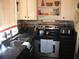 Updated kitchen featuring dark countertops and stainless steel appliances, and a window view at 200 N Betty Ln # 5F, Clearwater, FL 33755