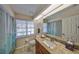 Bathroom featuring a vanity, granite countertops, tiled floors and a window that provides natural light at 2004 Berry Roberts Dr, Sun City Center, FL 33573